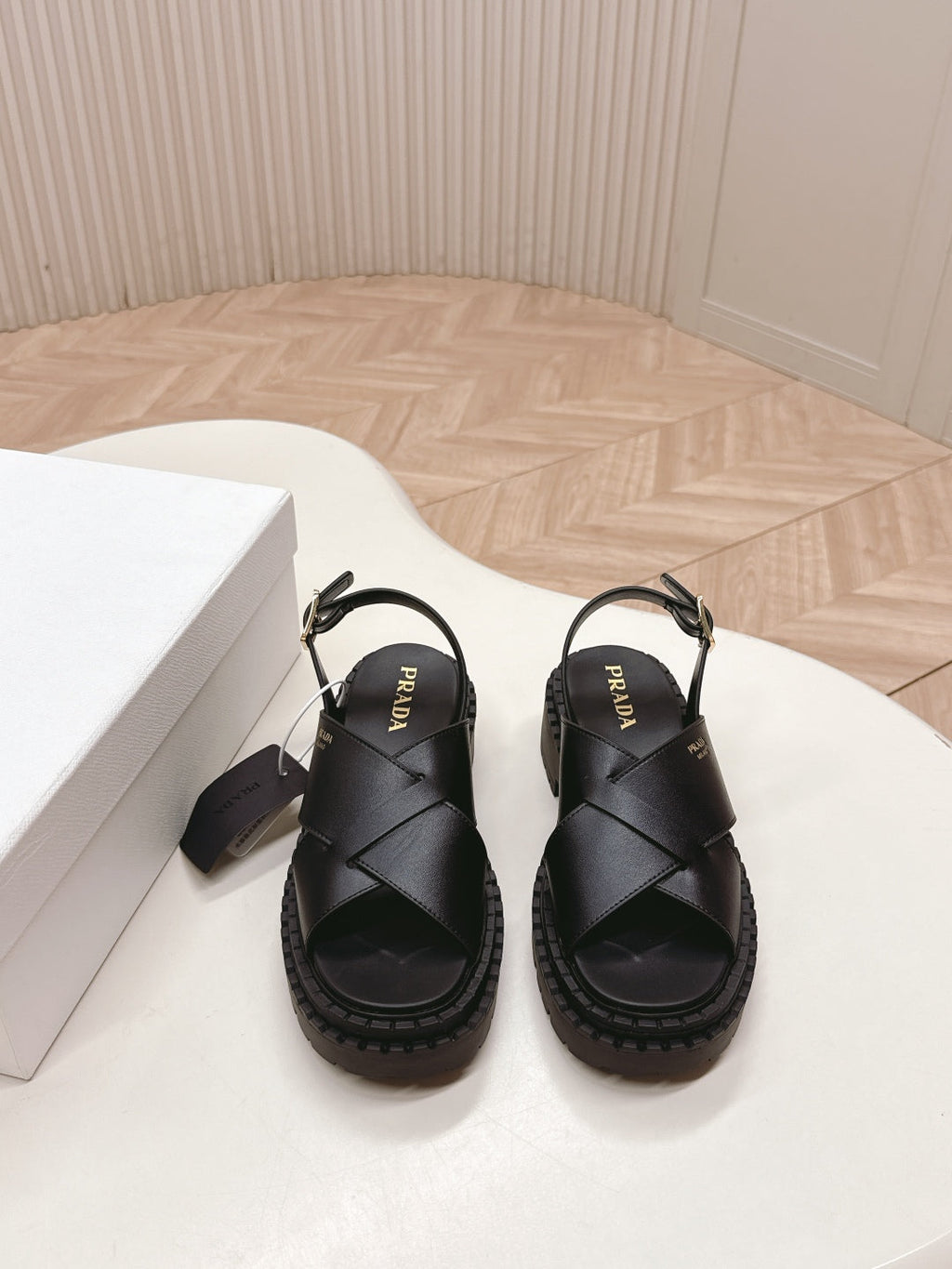 PRADA 25S CRISSCROSS SANDALS IN BLACK CALFSKIN