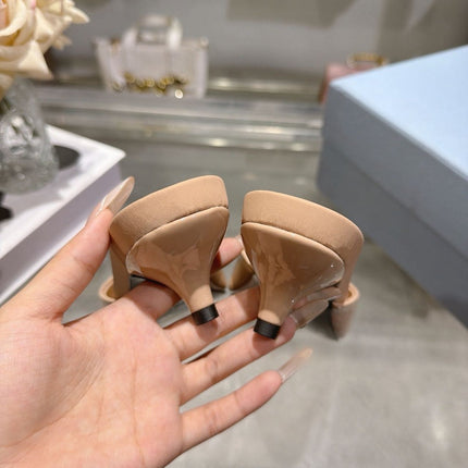 PRADA 26S LOGO EMBOSSED KITTEN HEEL MULES IN NUDE BEIGE PATENT CALFSKIN
