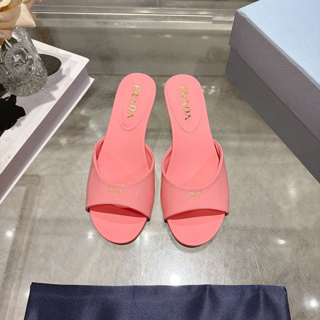 PRADA 26S LOGO EMBOSSED KITTEN HEEL MULES IN PINK PATENT CALFSKIN