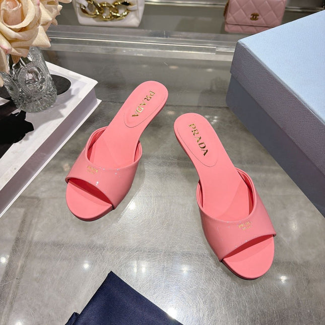 PRADA 26S LOGO EMBOSSED KITTEN HEEL MULES IN PINK PATENT CALFSKIN