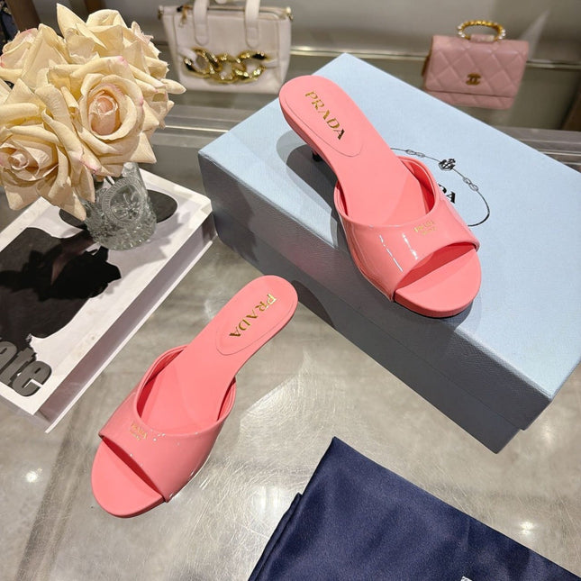 PRADA 26S LOGO EMBOSSED KITTEN HEEL MULES IN PINK PATENT CALFSKIN