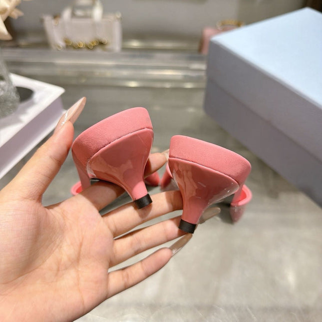 PRADA 26S LOGO EMBOSSED KITTEN HEEL MULES IN PINK PATENT CALFSKIN