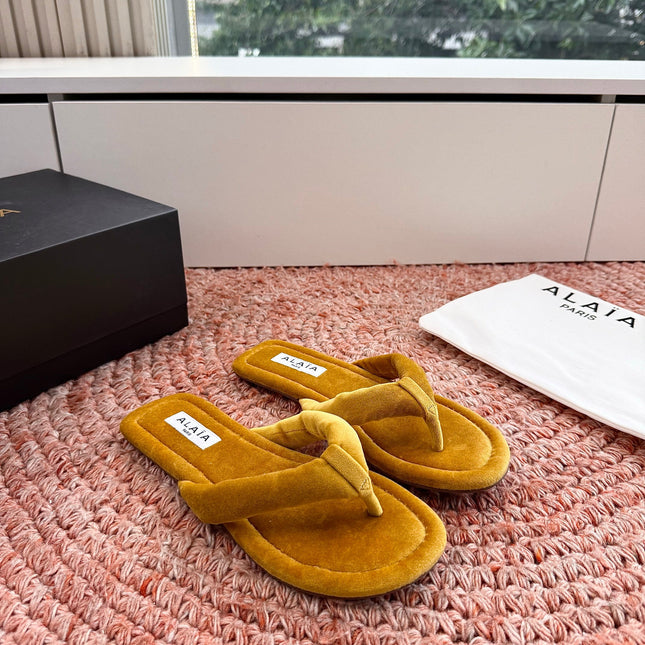 ALAIA 26S THONG SANDALS IN MUSTARD YELLOW VELVET
