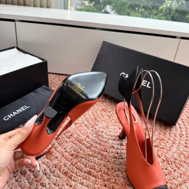 CHANEL 26S POINTED TOE HIGH HEEL SLINGBACKS IN ORANGE LAMBSKIN WITH BLACK FLORAL APPLIQUE