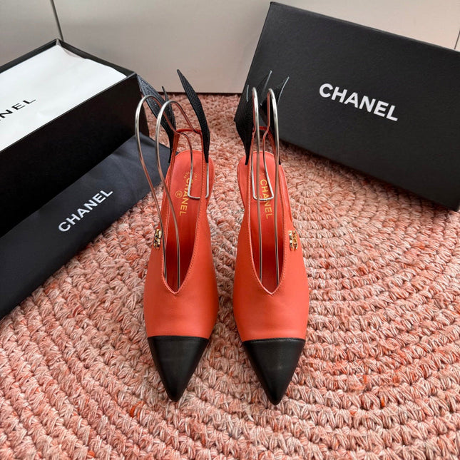 CHANEL 26S POINTED TOE HIGH HEEL SLINGBACKS IN ORANGE LAMBSKIN WITH BLACK FLORAL APPLIQUE