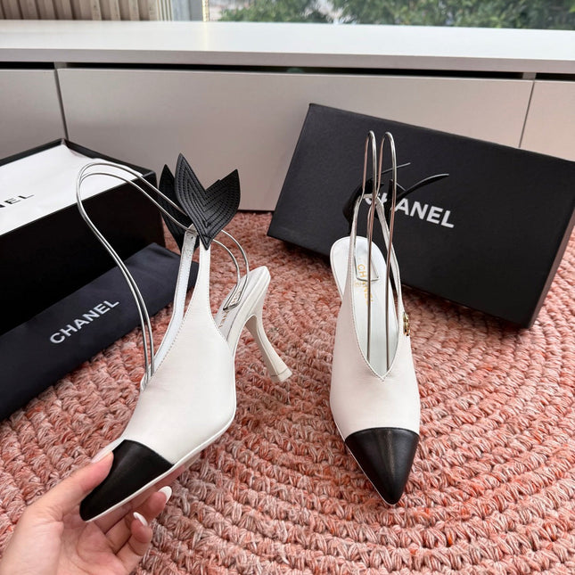 CHANEL 26S POINTED TOE HIGH HEEL SLINGBACKS IN WHITE LAMBSKIN WITH BLACK FLORAL APPLIQUE