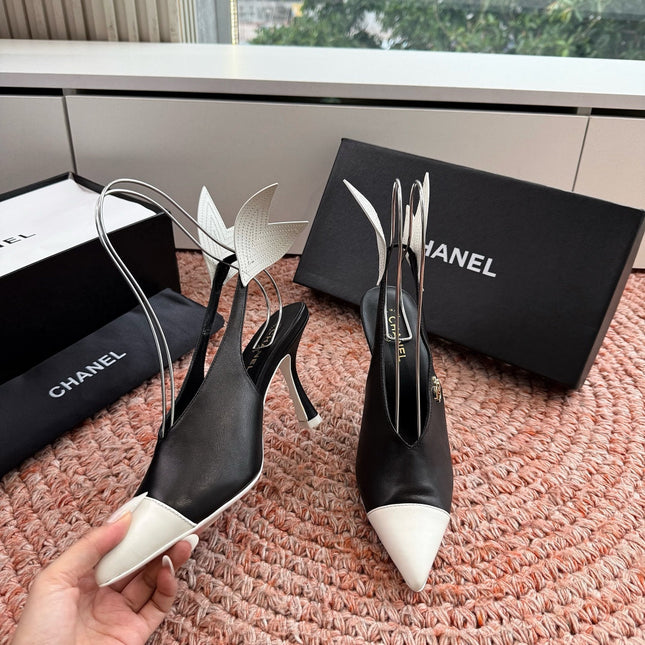 CHANEL 26S POINTED TOE HIGH HEEL SLINGBACKS IN BLACK AND WHITE LAMBSKIN WITH FLORAL APPLIQUE