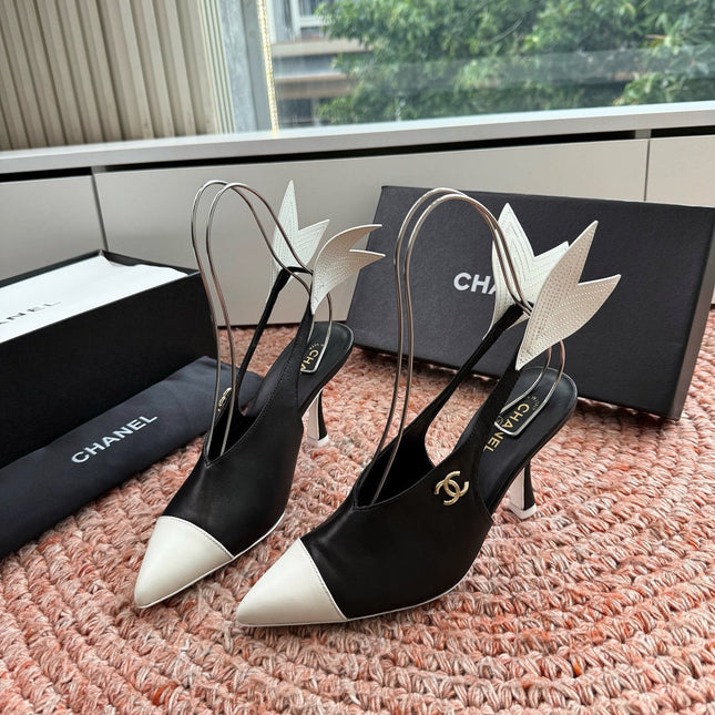 CHANEL 26S POINTED TOE HIGH HEEL SLINGBACKS IN BLACK AND WHITE LAMBSKIN WITH FLORAL APPLIQUE
