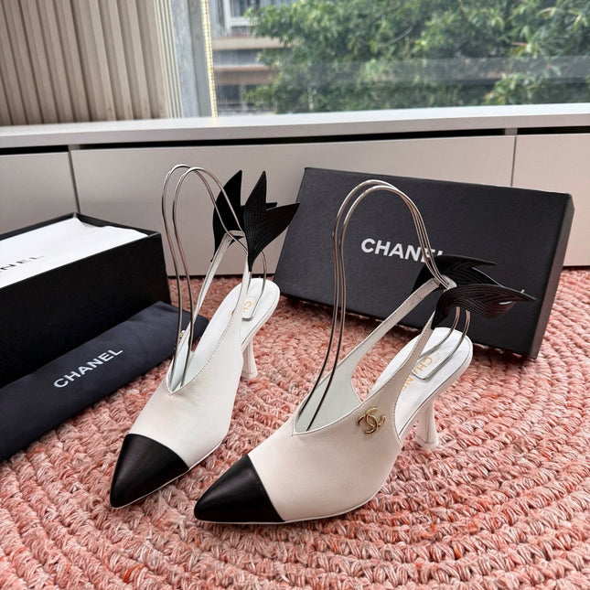 CHANEL 26S POINTED TOE HIGH HEEL SLINGBACKS IN WHITE LAMBSKIN WITH BLACK FLORAL APPLIQUE