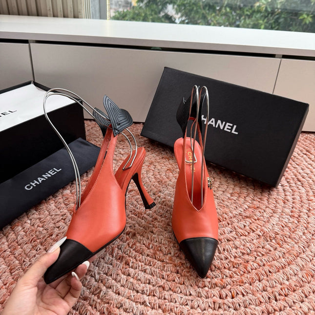 CHANEL 26S POINTED TOE HIGH HEEL SLINGBACKS IN ORANGE LAMBSKIN WITH BLACK FLORAL APPLIQUE
