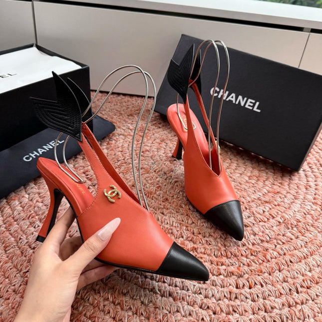CHANEL 26S POINTED TOE HIGH HEEL SLINGBACKS IN ORANGE LAMBSKIN WITH BLACK FLORAL APPLIQUE
