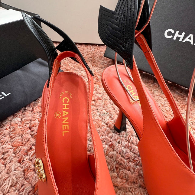 CHANEL 26S POINTED TOE HIGH HEEL SLINGBACKS IN ORANGE LAMBSKIN WITH BLACK FLORAL APPLIQUE