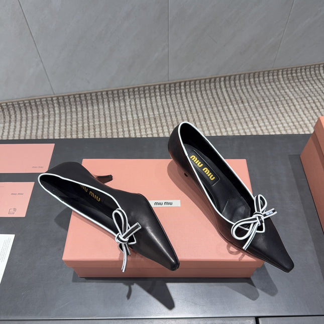 MIUMIU 26S POINTED TOE PUMPS 55MM IN BLACK AND WHITE CALFSKIN WITH BOW