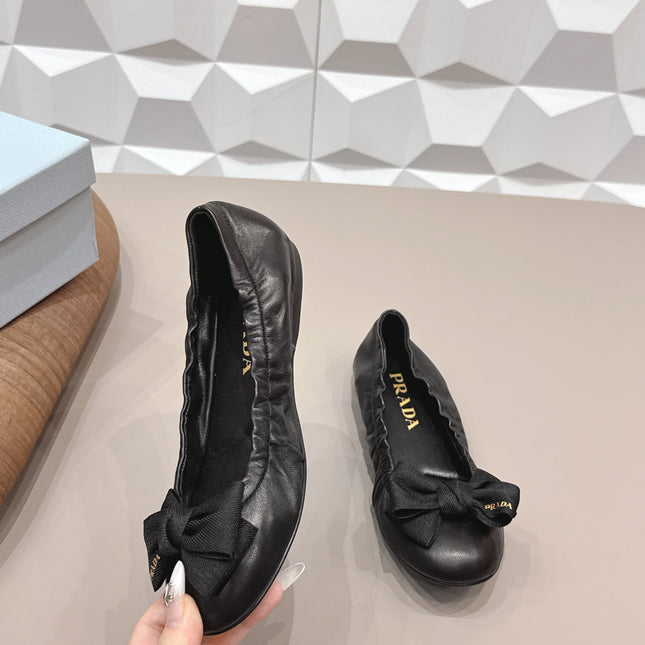 PRADA 26S ROUND TOE FLATS WITH BOW IN BLACK CALFSKIN