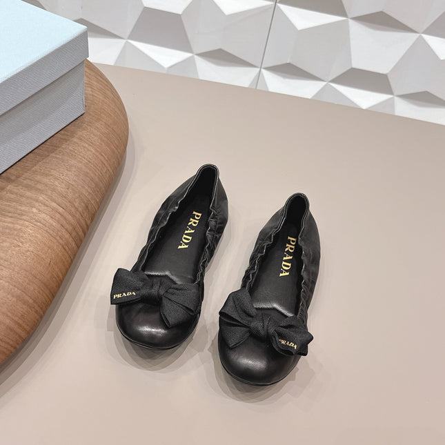 PRADA 26S ROUND TOE FLATS WITH BOW IN BLACK CALFSKIN