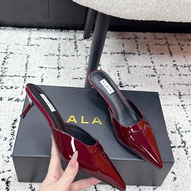 ALAIA 26S HEELED MULES 65 MM IN DARK RED GLOSSY CALFSKIN