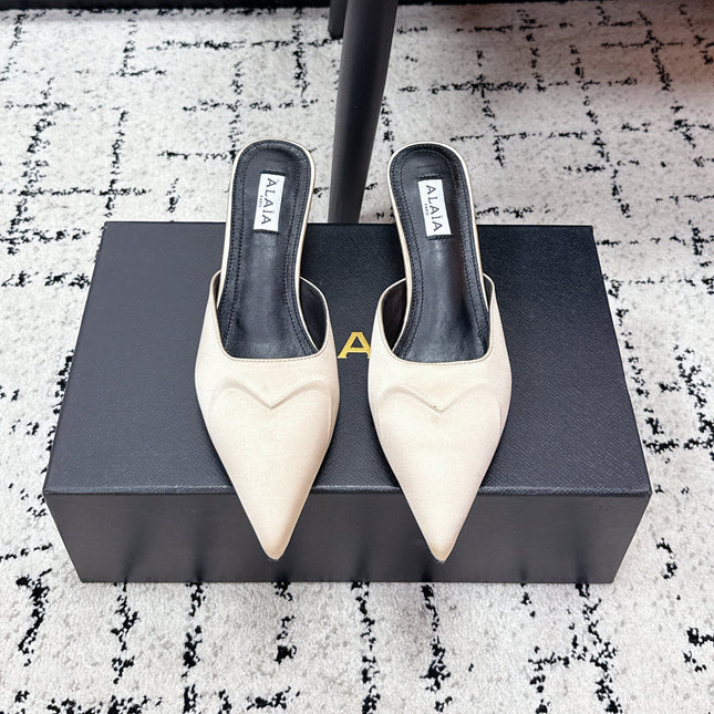 ALAIA 26S HEELED MULES 65 MM IN IVORY BEIGE SATIN