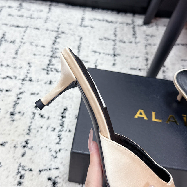 ALAIA 26S HEELED MULES 65 MM IN IVORY BEIGE SATIN