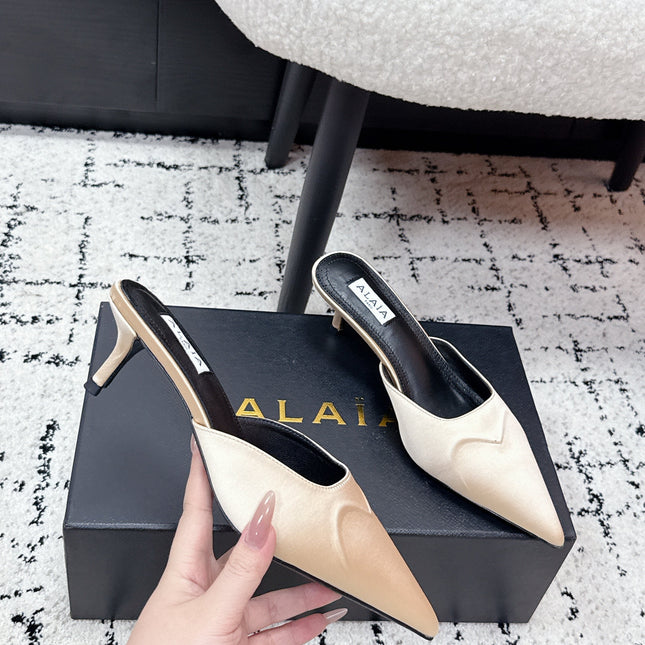 ALAIA 26S HEELED MULES 65 MM IN IVORY BEIGE SATIN