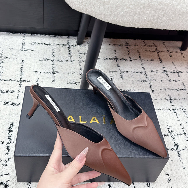 ALAIA 26S HEELED MULES 65 MM IN CHOCOLATE BROWN SATIN