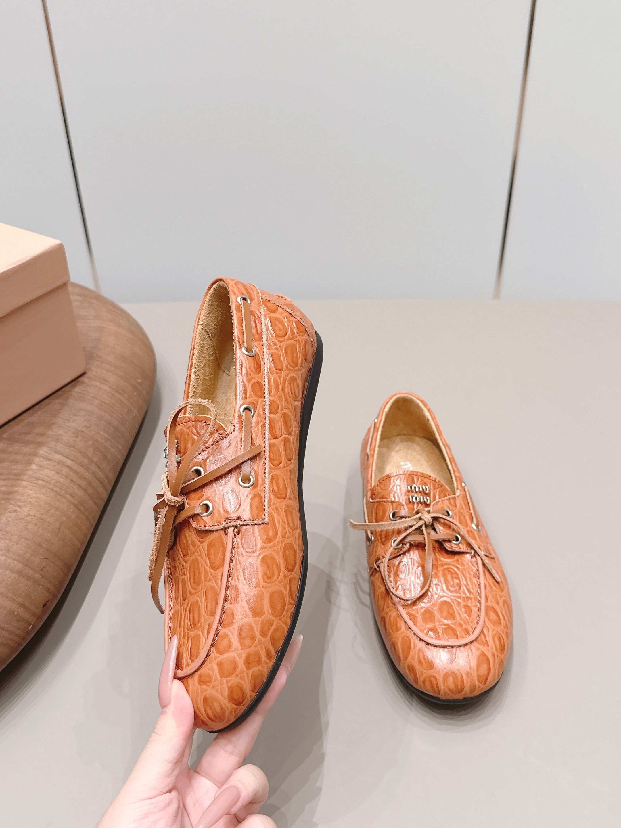 MIUMIU 26S BOAT SHOES IN ORANGE BROWN EMBOSSED CALFSKIN