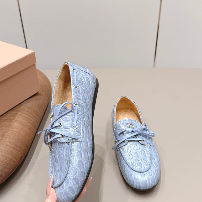 MIUMIU 26S BOAT SHOES IN BLUE EMBOSSED CALFSKIN
