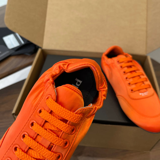 PRADA 25S SNEAKER IN ORANGE SILK