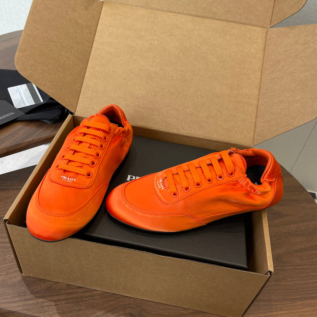 PRADA 25S SNEAKER IN ORANGE SILK