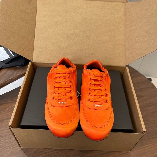 PRADA 25S SNEAKER IN ORANGE SILK
