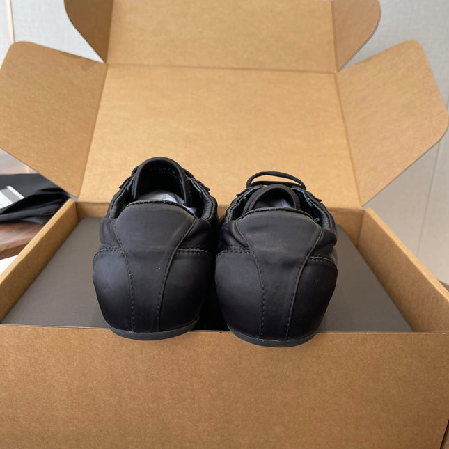 PRADA 25S SNEAKER IN BLACK SILK