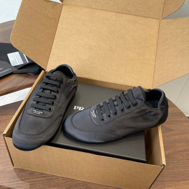 PRADA 25S SNEAKER IN BLACK SILK