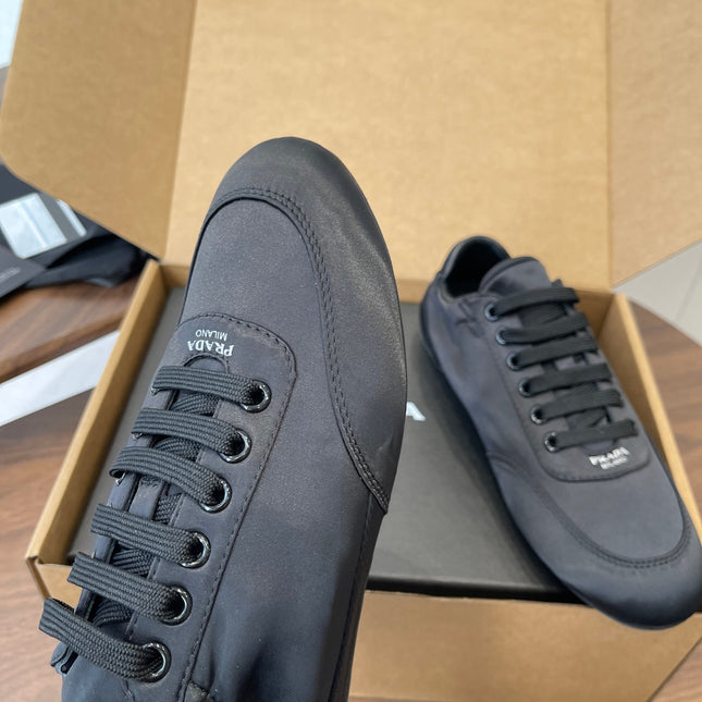 PRADA 25S SNEAKER IN BLACK SILK