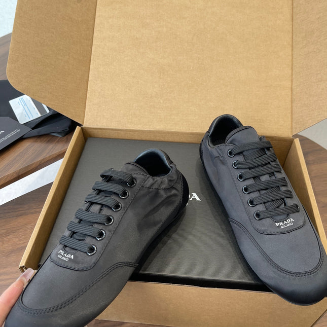 PRADA 25S SNEAKER IN BLACK SILK