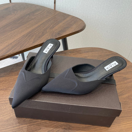 ALAIA 26S HEELED MULES 50 MM IN BLACK FABRIC
