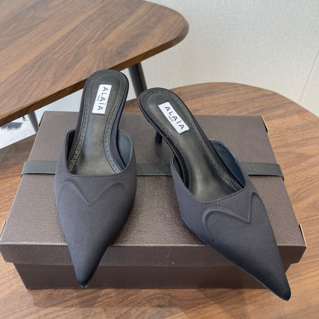 ALAIA 26S HEELED MULES 50 MM IN BLACK FABRIC