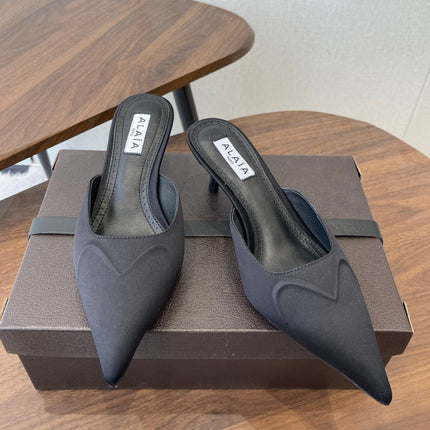 ALAIA 26S HEELED MULES 50 MM IN BLACK FABRIC
