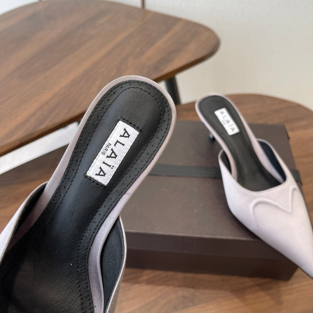 ALAIA 26S HEELED MULES 50 MM IN LAVENDER GREY FABRIC