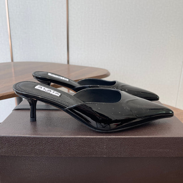 ALAIA 26S HEELED MULES 50 MM IN BLACK GLOSSY CALFSKIN