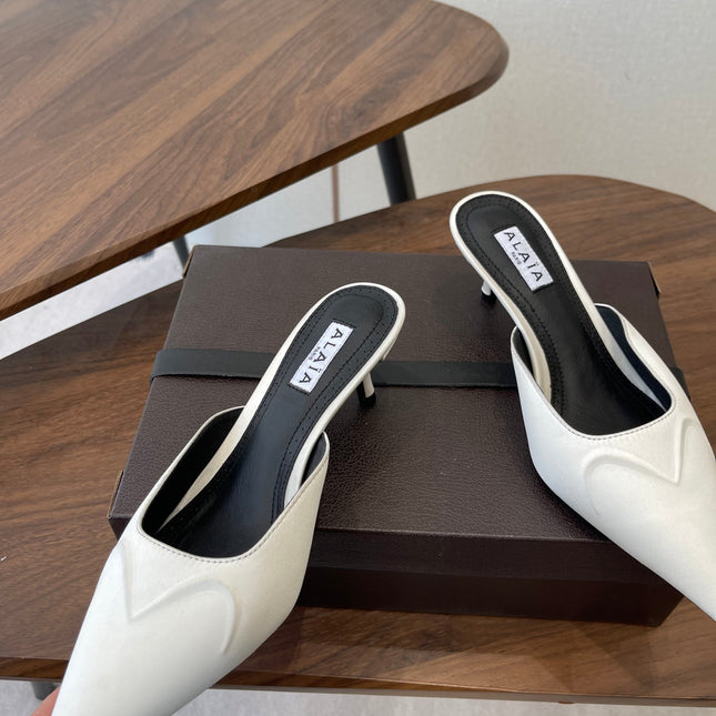 ALAIA 26S HEELED MULES 50 MM IN WHITE FABRIC
