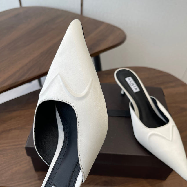 ALAIA 26S HEELED MULES 50 MM IN WHITE FABRIC