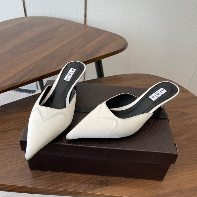 ALAIA 26S HEELED MULES 50 MM IN WHITE FABRIC