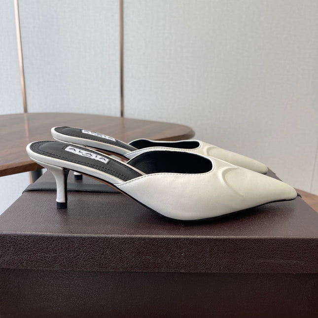 ALAIA 26S HEELED MULES 50 MM IN WHITE FABRIC