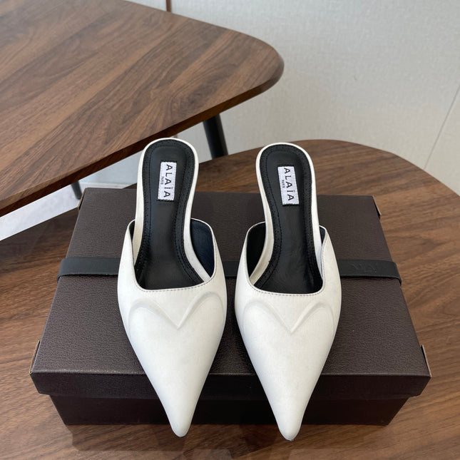 ALAIA 26S HEELED MULES 50 MM IN WHITE FABRIC