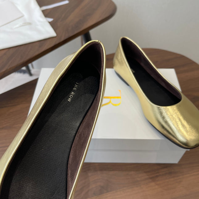 THE ROW 26S FLATS IN GOLD CALFSKIN
