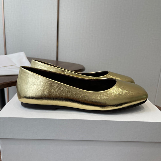 THE ROW 26S FLATS IN GOLD CALFSKIN