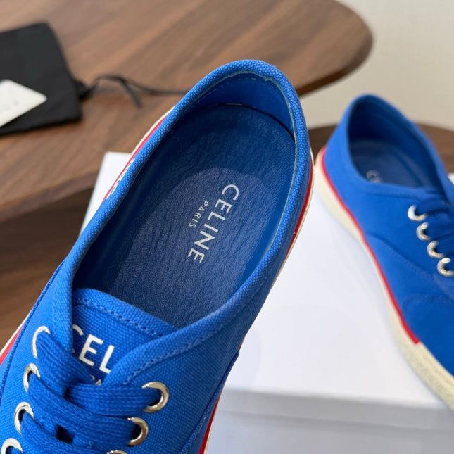 CELINE 26S TRIOMPHE LOW TOP SNEAKERS IN BLUE CANVAS RED TRIM