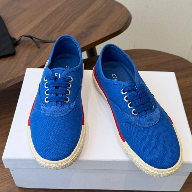 CELINE 26S TRIOMPHE LOW TOP SNEAKERS IN BLUE CANVAS RED TRIM