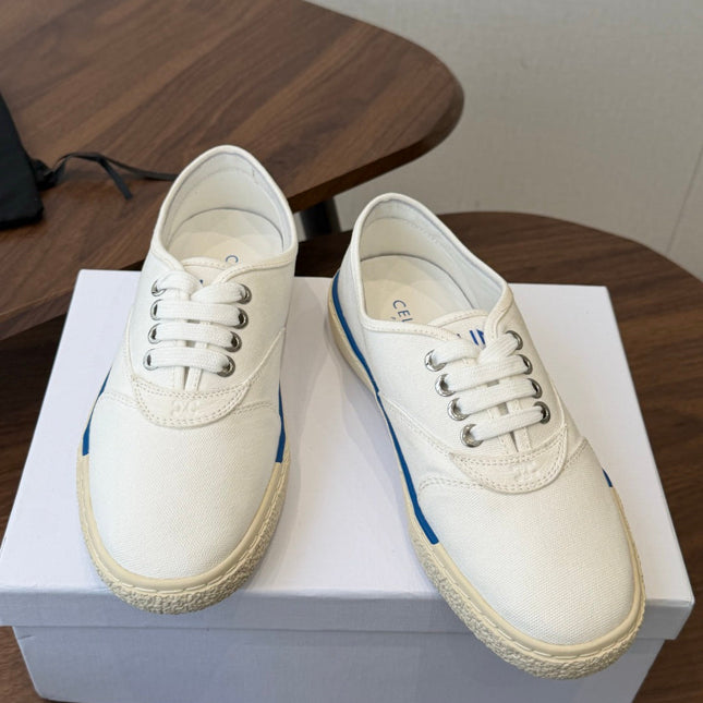 CELINE 26S TRIOMPHE LOW TOP SNEAKERS IN WHITE CANVAS BLUE TRIM