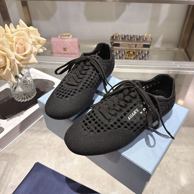 PRADA 26S LACE UP OPENWORK KNIT SNEAKERS IN BLACK KNIT FABRIC