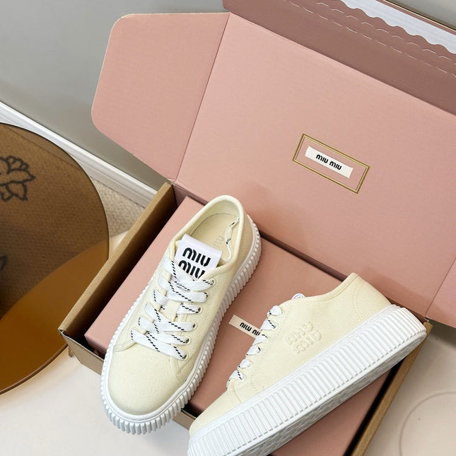 MIUMIU 26S PLATFORM SNEAKERS IN LIGHT YELLOW CANVAS
